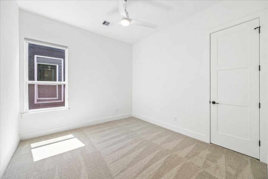 Bright, airy, and intentionally simple, this room adapts effortlessly as a guest suite, nursery, or home office.