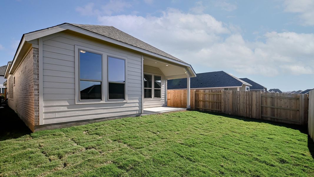 Exterior details and patio area of a home in Crosswinds 40', Kyle (Image 24).