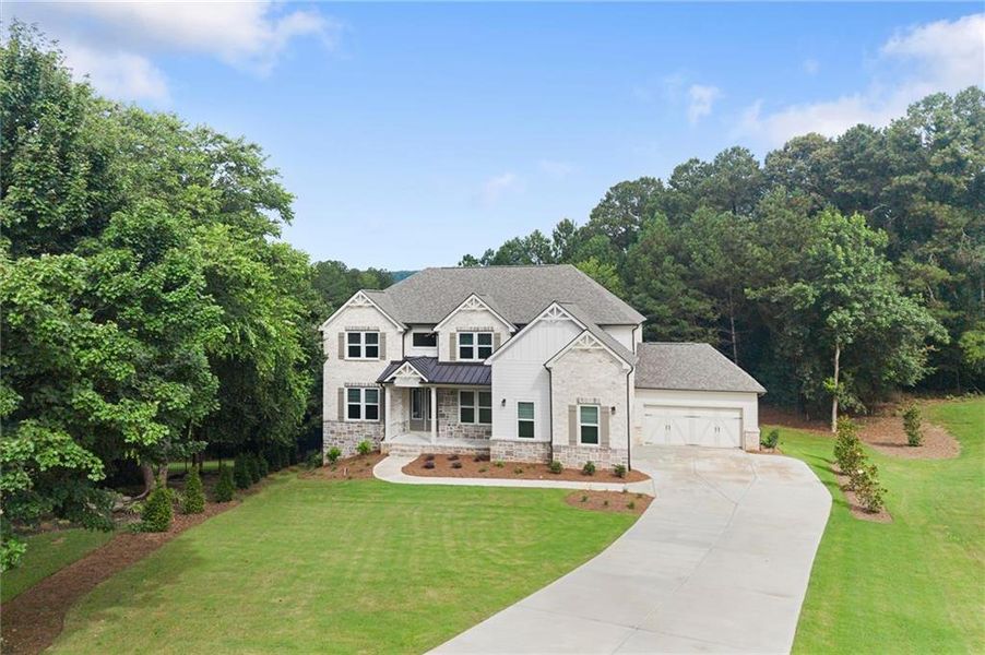 Front exterior of a new home in , Flowery Branch, GA, highlighting curb appeal (Image 2). Front exterior of a new home in , Flowery Branch, GA, highlighting curb appeal (Image 2).