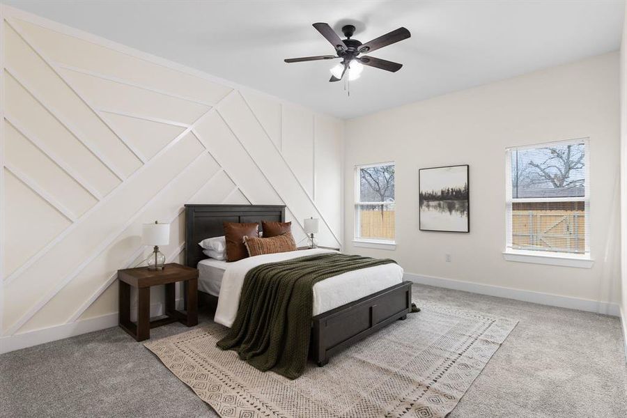 Bedroom with light carpet and ceiling fan