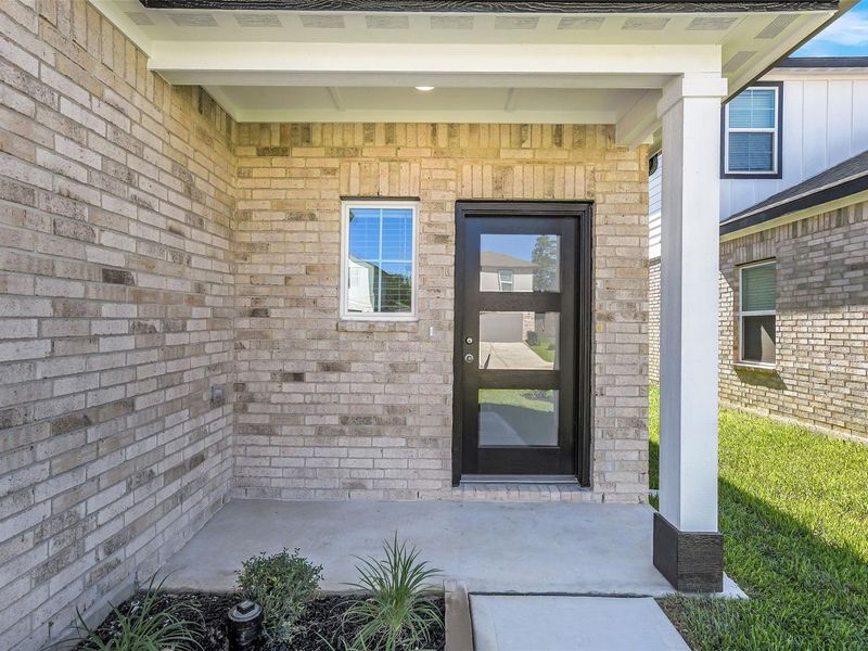 Exterior details and patio area of a home in Lakes at Black Oak, Magnolia (Image 3). Exterior details and patio area of a home in Lakes at Black Oak, Magnolia (Image 3).