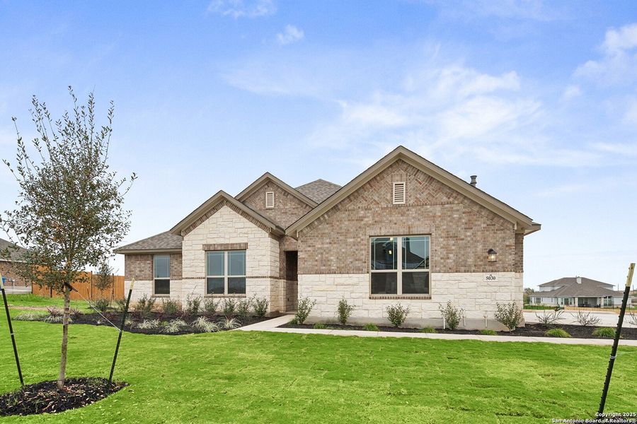 Front exterior of a new home in Everly Estates, San Antonio, TX, highlighting curb appeal (Image 19).