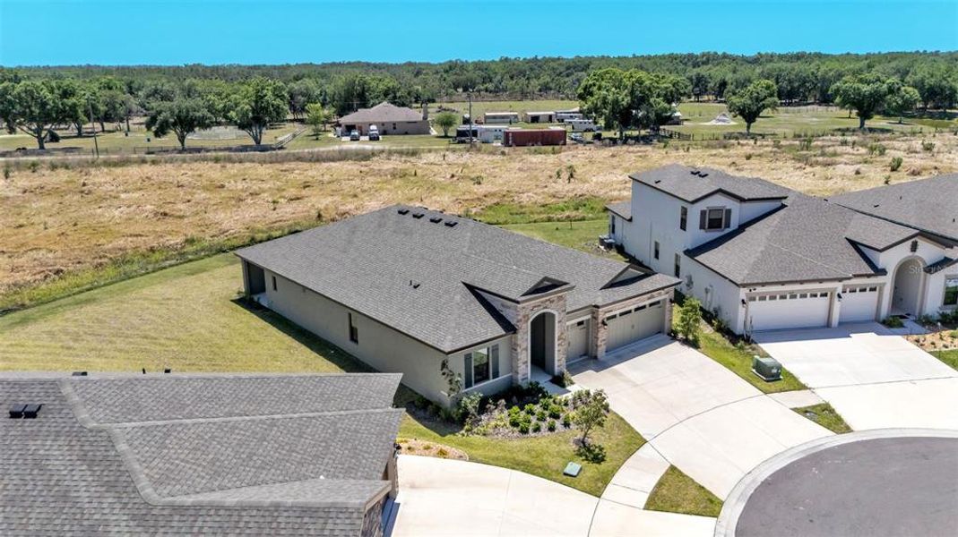 Front exterior of a new home in Hawkstone, Lithia, FL, highlighting curb appeal (Image 31).
