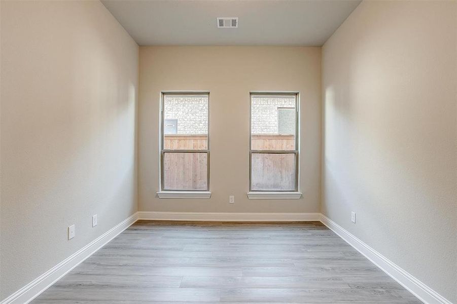 Unfurnished room featuring light wood-type flooring