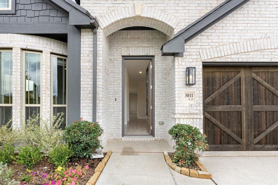 Exterior details and patio area of a home in Waterscape, Royse City (Image 26).