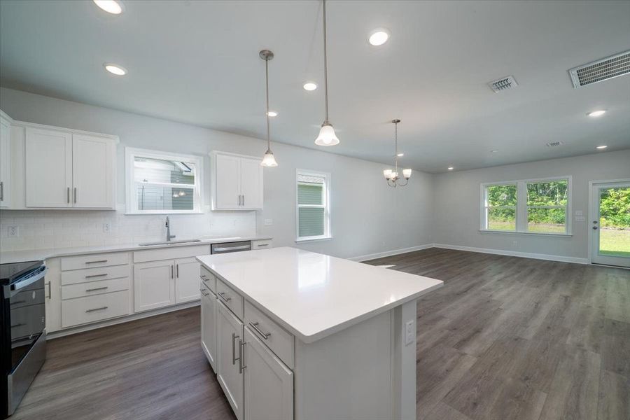 Open Kitchen with white cabinets and granite countertops. Open Kitchen with white cabinets and granite countertops.