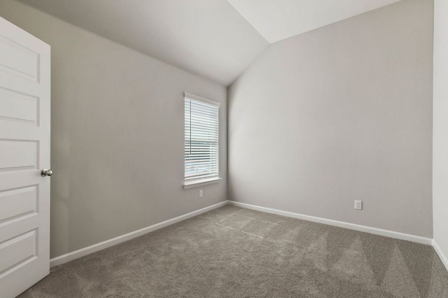 Bedroom in the Quartz home plan by Trophy Signature Homes – REPRESENTATIVE PHOTO