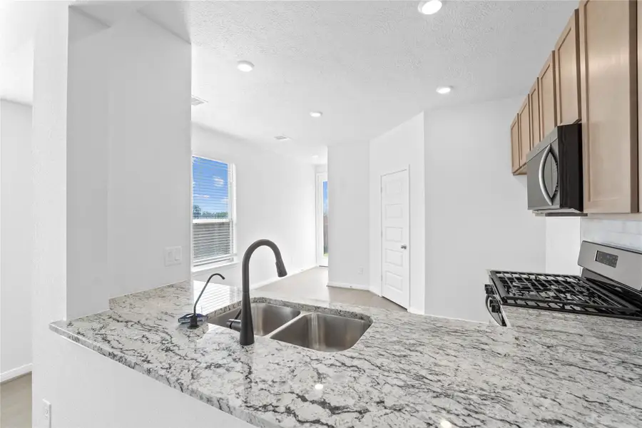 The gorgeous granite countertops are featured here in Delicatus White. The gorgeous granite countertops are featured here in Delicatus White.