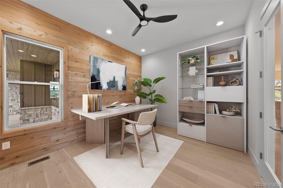 Virtually staged to inspire - the main-floor office features a rustic-stained cedar accent wall and French door entry.