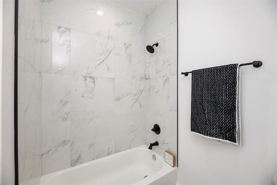 Full bathroom featuring shower / bathtub combination Full bathroom featuring shower / bathtub combination