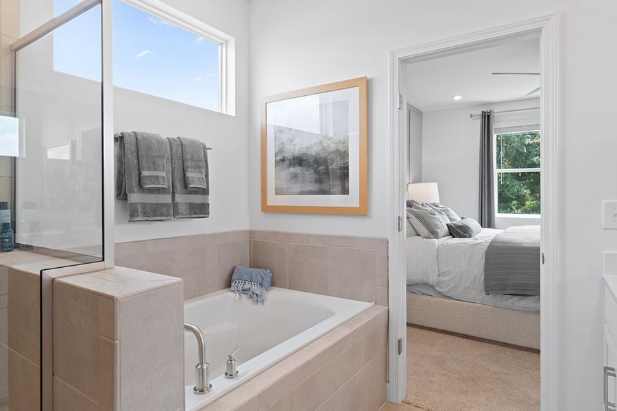 A bathroom with a tub and a sink.