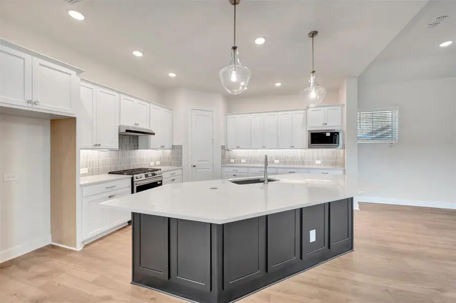 Furnished interior view inside a new home in Riceland - Enclave Row Collection, Mont Belvieu (Image 4).
