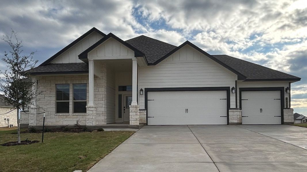 Front exterior of a new home in Sterling Meadows, Salado, TX, highlighting curb appeal (Image 1). Front exterior of a new home in Sterling Meadows, Salado, TX, highlighting curb appeal (Image 1).