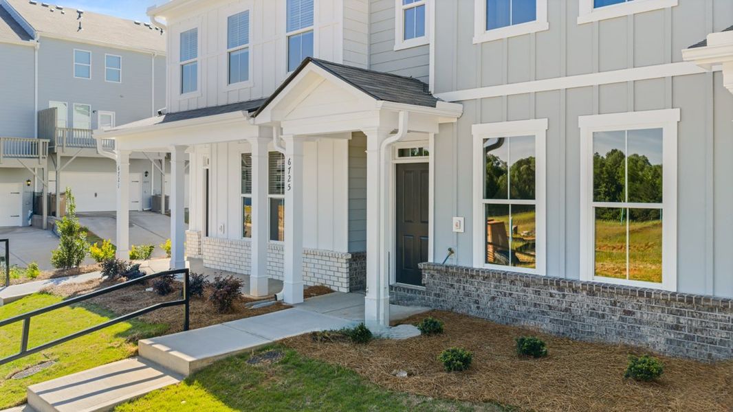 Representative exterior photo of a completed home built from the AMESBURY by D.R. Horton in Waypoint, Flowery Branch, GA (Image 18).