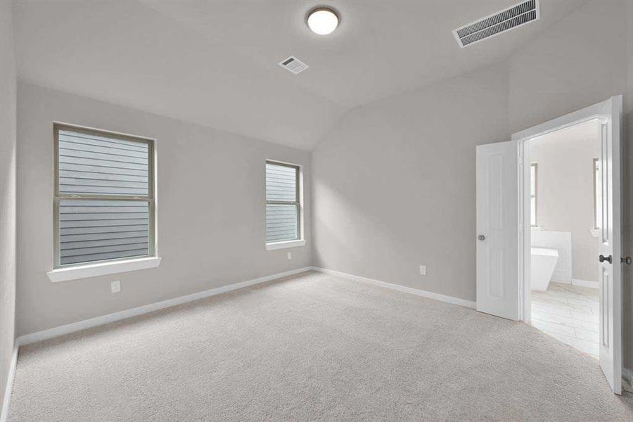 Generous retreat with vaulted ceilings and natural light. (Original Builder Staged Photo 2024)