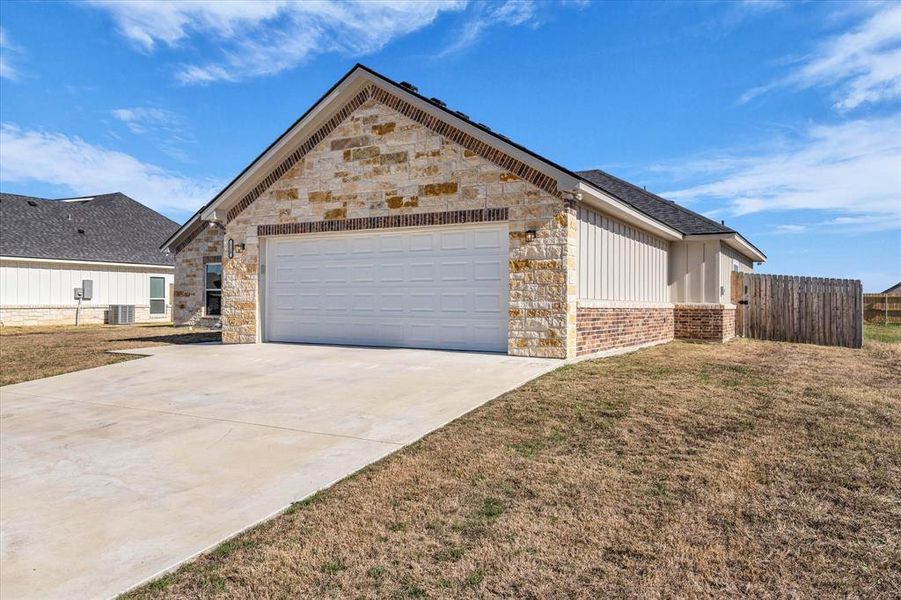 Front exterior of a new home in , Riesel, TX, highlighting curb appeal (Image 18).