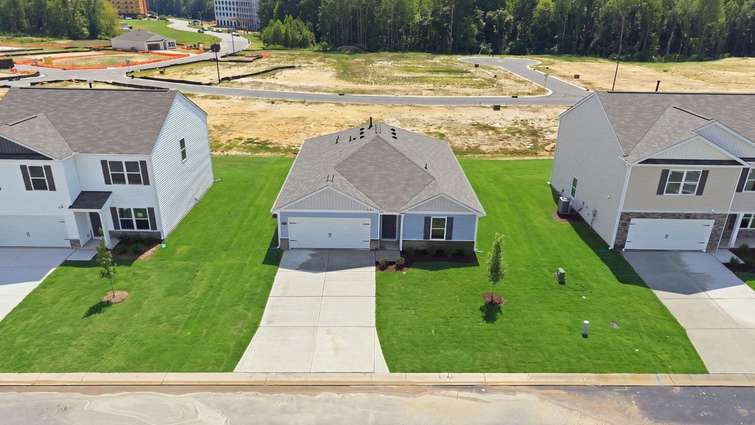 Front exterior of a new home in Hunter Hill, Rocky Mount, NC, highlighting curb appeal (Image 18). Front exterior of a new home in Hunter Hill, Rocky Mount, NC, highlighting curb appeal (Image 18).