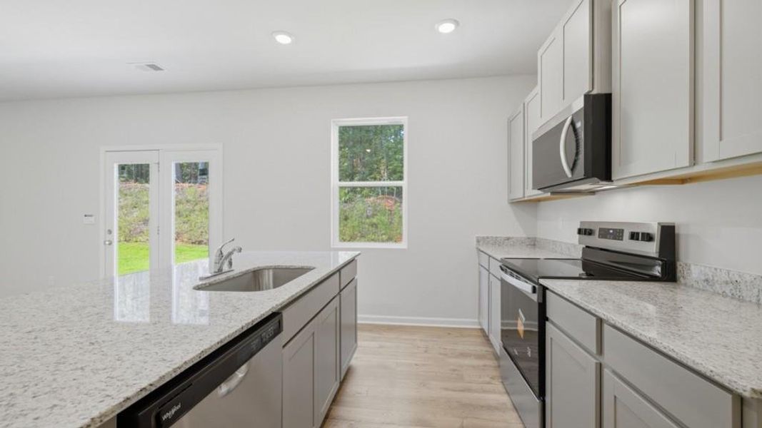 Furnished interior view inside a new home in Oaks at Cedar Grove, Fairburn (Image 5).