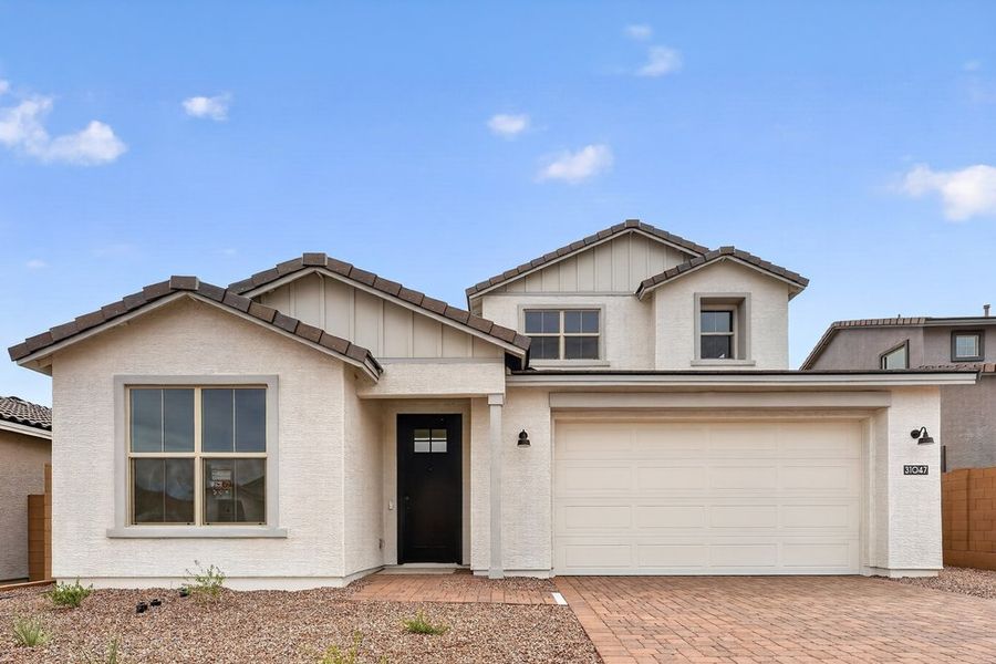 Front exterior of a new home in Ladera Trails, Queen Creek, AZ, highlighting curb appeal (Image 1). Front exterior of a new home in Ladera Trails, Queen Creek, AZ, highlighting curb appeal (Image 1).