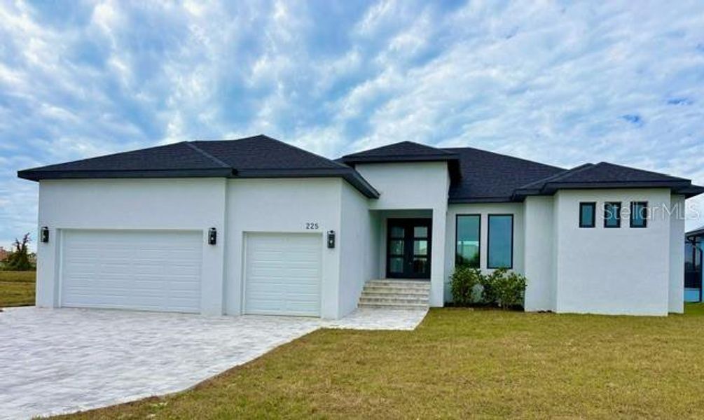 Front exterior of a new home in , Rotonda West, FL, highlighting curb appeal (Image 24).