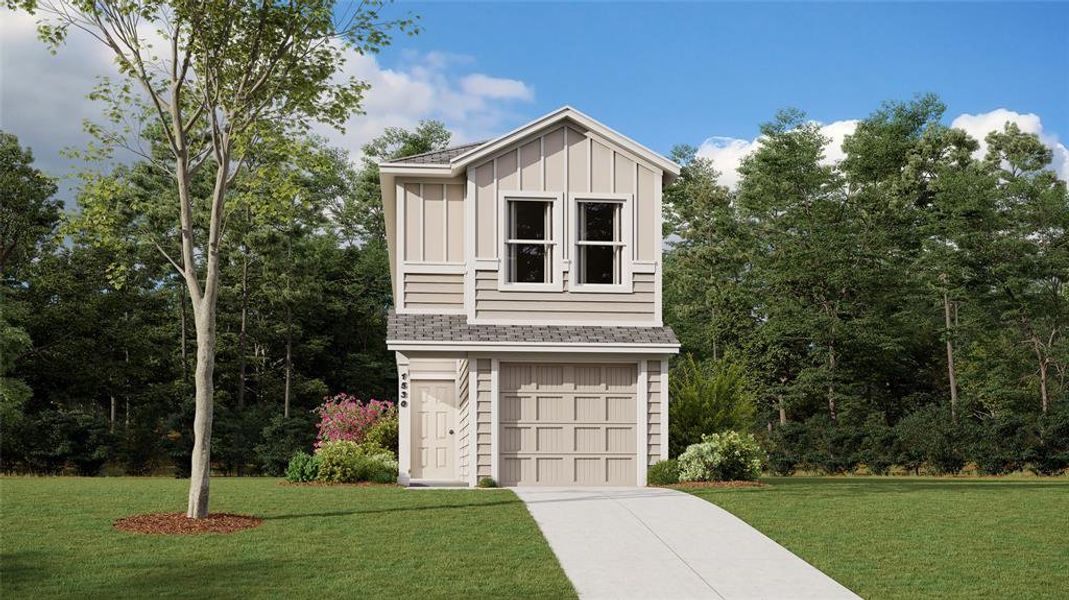 View of front of home featuring a garage and a front lawn