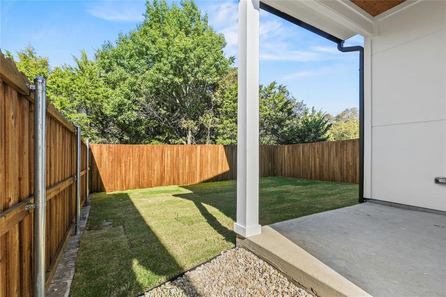 Fenced backyard featuring a patio area