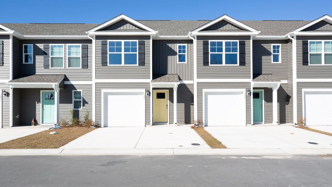Front exterior of a new home in Townes at Seabrooke, Leland, NC, highlighting curb appeal (Image 1).