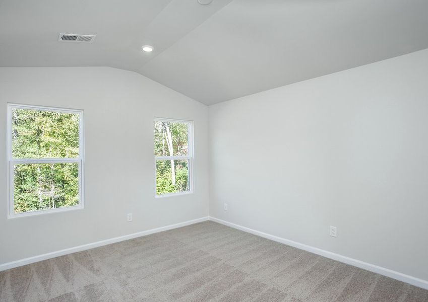 The master bedroom is filled with natural lighting.