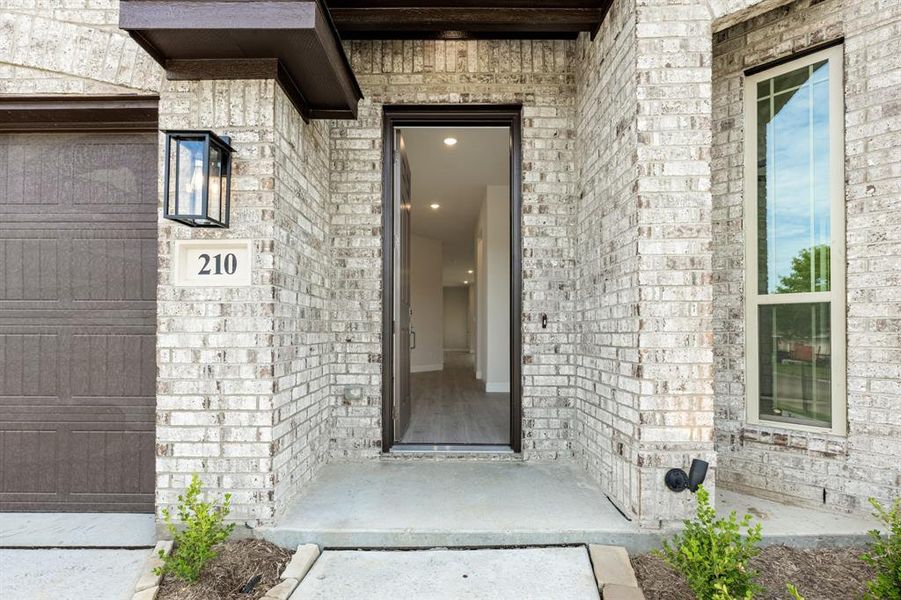 Front exterior of a new home in Sunset Ridge, Alvarado, TX, highlighting curb appeal (Image 23).