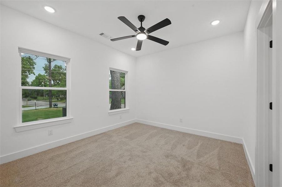 Carpeted empty room with baseboards, recessed lighting, and ceiling fan