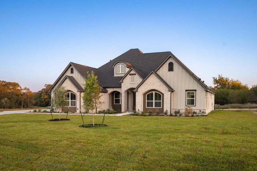 Representative exterior photo of a completed home built from the The Sophie by Reece Homes in Traditions, Bryan, TX (Image 31).