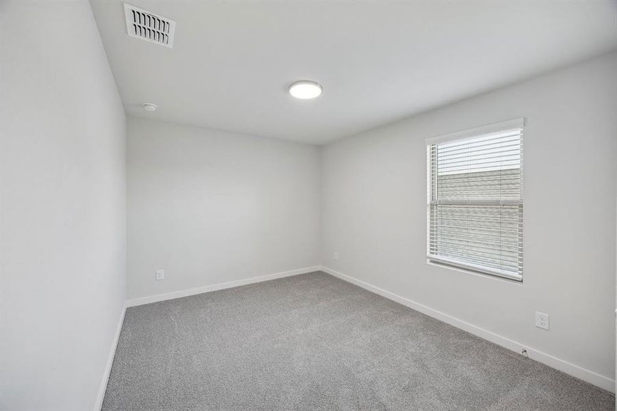 Bedroom in the Oak II home plan by Trophy Signature Homes – REPRESENTATIVE PHOTO