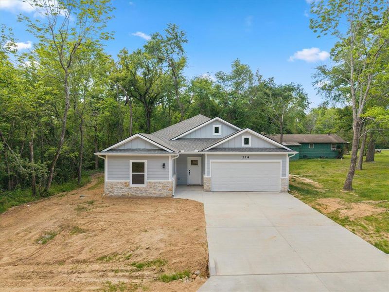 Front exterior of a new home in , Payne Springs, TX, highlighting curb appeal (Image 2). Front exterior of a new home in , Payne Springs, TX, highlighting curb appeal (Image 2).