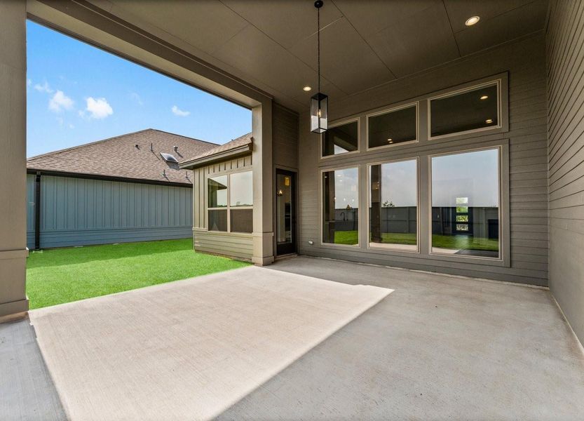 The grand size covered patio is filled w/natural lighting and a view of the well-maintained backyard. Perfect for outdoor entertaining and relaxation.