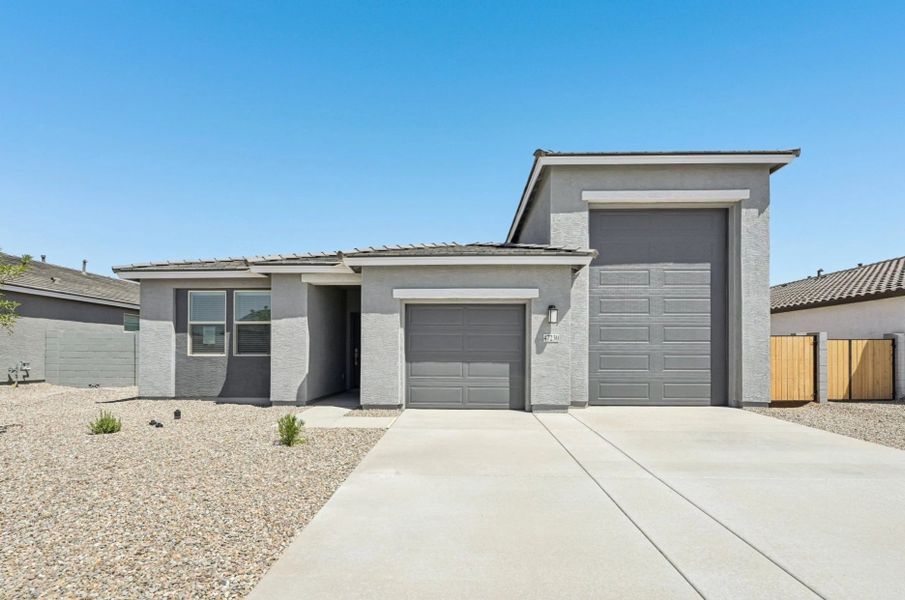 Representative exterior photo of a completed home built from the Opal RV Garage by Ashton Woods in Sanctuary at Stonebridge Manor, Waddell, AZ (Image 15).