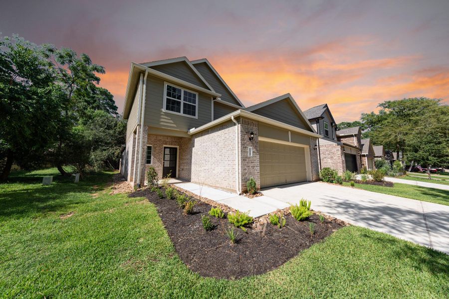 Front exterior of a new home in Lake Conroe Area Homes, Montgomery, TX, highlighting curb appeal (Image 2).