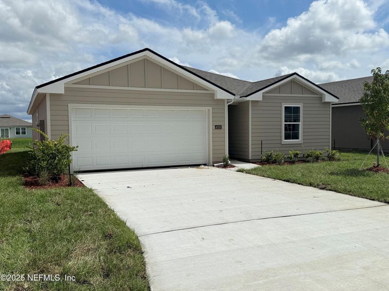 Front exterior of a new home in The Arbors, Jacksonville, FL, highlighting curb appeal (Image 27).