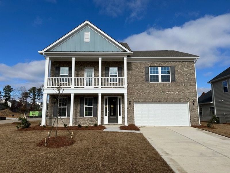 Front exterior of a new home in Pebble Branch, Chapin, SC, highlighting curb appeal (Image 1). Front exterior of a new home in Pebble Branch, Chapin, SC, highlighting curb appeal (Image 1).
