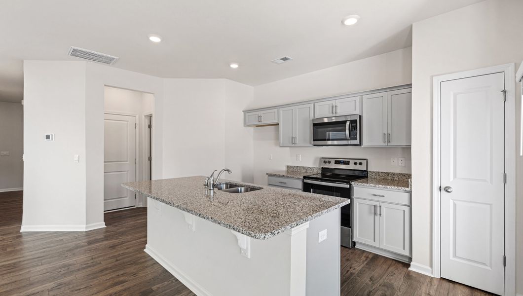 Furnished interior view inside a new home in Tanglewood Townes, Greenville (Image 7).