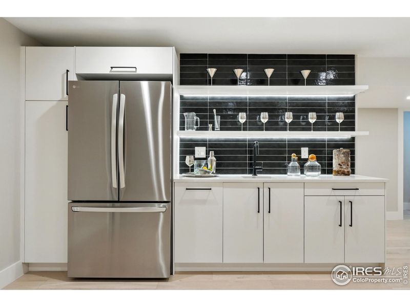 Basement wet bar with full sized refrigerator Basement wet bar with full sized refrigerator