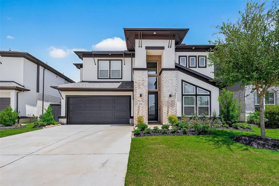 Front exterior of a new home in , Richmond, TX, highlighting curb appeal (Image 24). Front exterior of a new home in , Richmond, TX, highlighting curb appeal (Image 24).