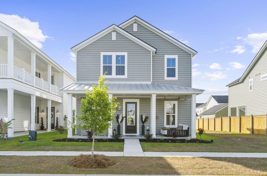 Front exterior of a new home in Heron's Walk at Summers Corner, Summerville, SC, highlighting curb appeal (Image 1). Front exterior of a new home in Heron's Walk at Summers Corner, Summerville, SC, highlighting curb appeal (Image 1).