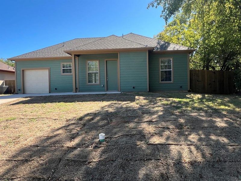 View of front of property with roof with shingles, a garage, and concrete driveway View of front of property with roof with shingles, a garage, and concrete driveway