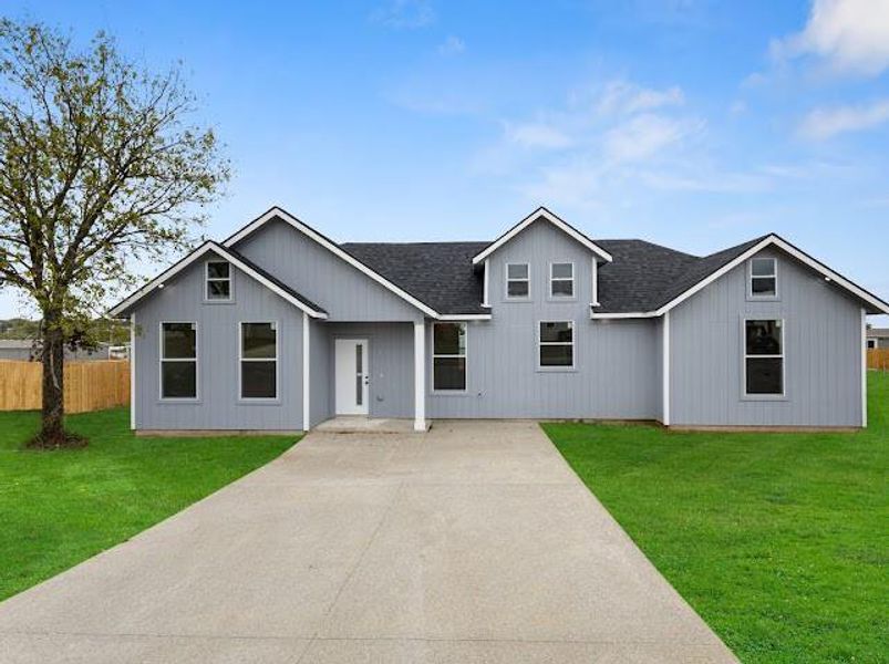 Modern farmhouse with a shingled roof Modern farmhouse with a shingled roof