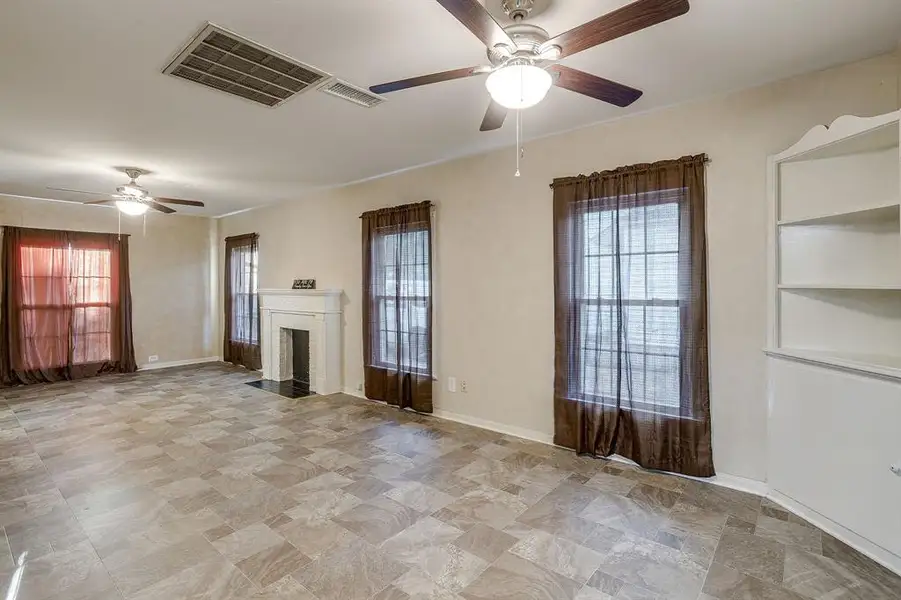 Downstairs primary bedroom with ceiling fans Downstairs primary bedroom with ceiling fans