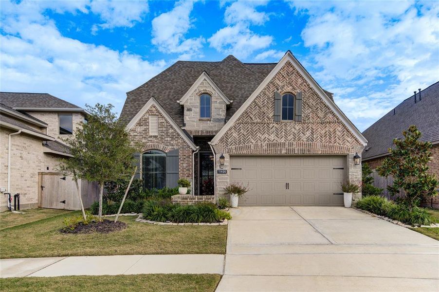 Elegant and clean elevation with stone and brick.