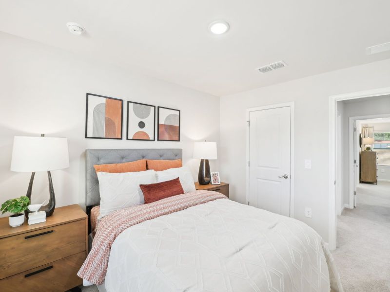 Secondary bedroom in the Topaz floorplan at a Meritage Homes community in Mebane, NC.