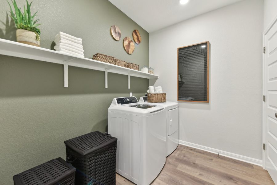A kitchen with a white stove and shelves. A kitchen with a white stove and shelves.