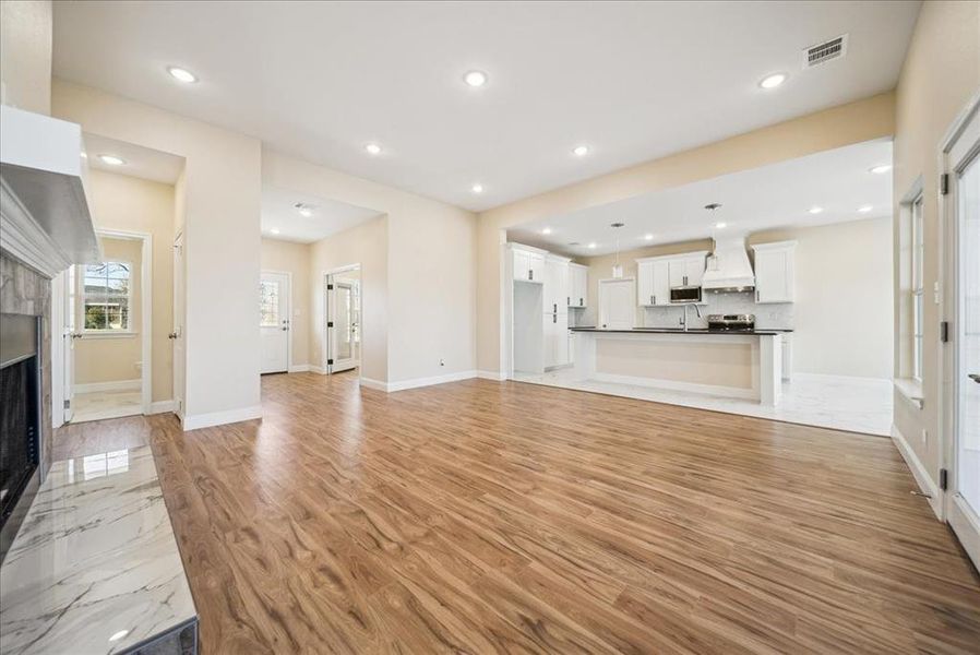 Unfurnished living room with light hardwood / wood-style flooring