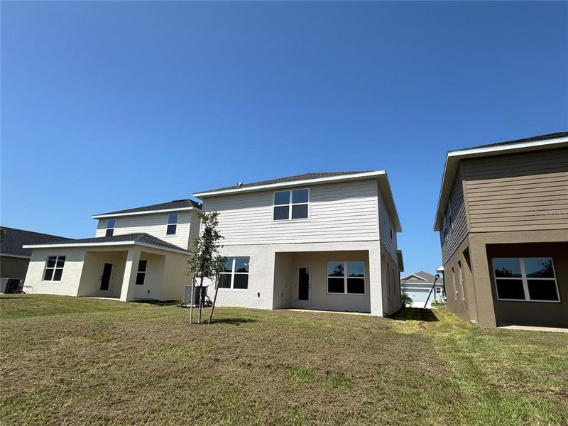 Front exterior of a new home in Harmony Central, Harmony, FL, highlighting curb appeal (Image 1). Front exterior of a new home in Harmony Central, Harmony, FL, highlighting curb appeal (Image 1).